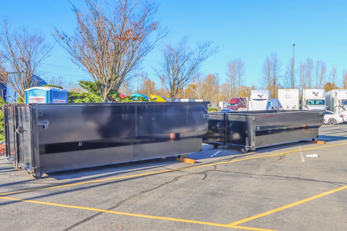Professional dumpster rental service with roll-off container on residential driveway in Silver Lakes